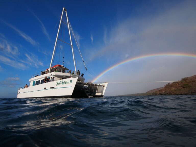 Four Winds boat and rainbow over the water during Morning Snorkel at Molokini Crater Tour in Maui