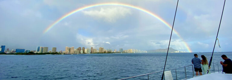 Full rainbow over Waikiki Bay on the Makani Catamaran during Oahu boat tour