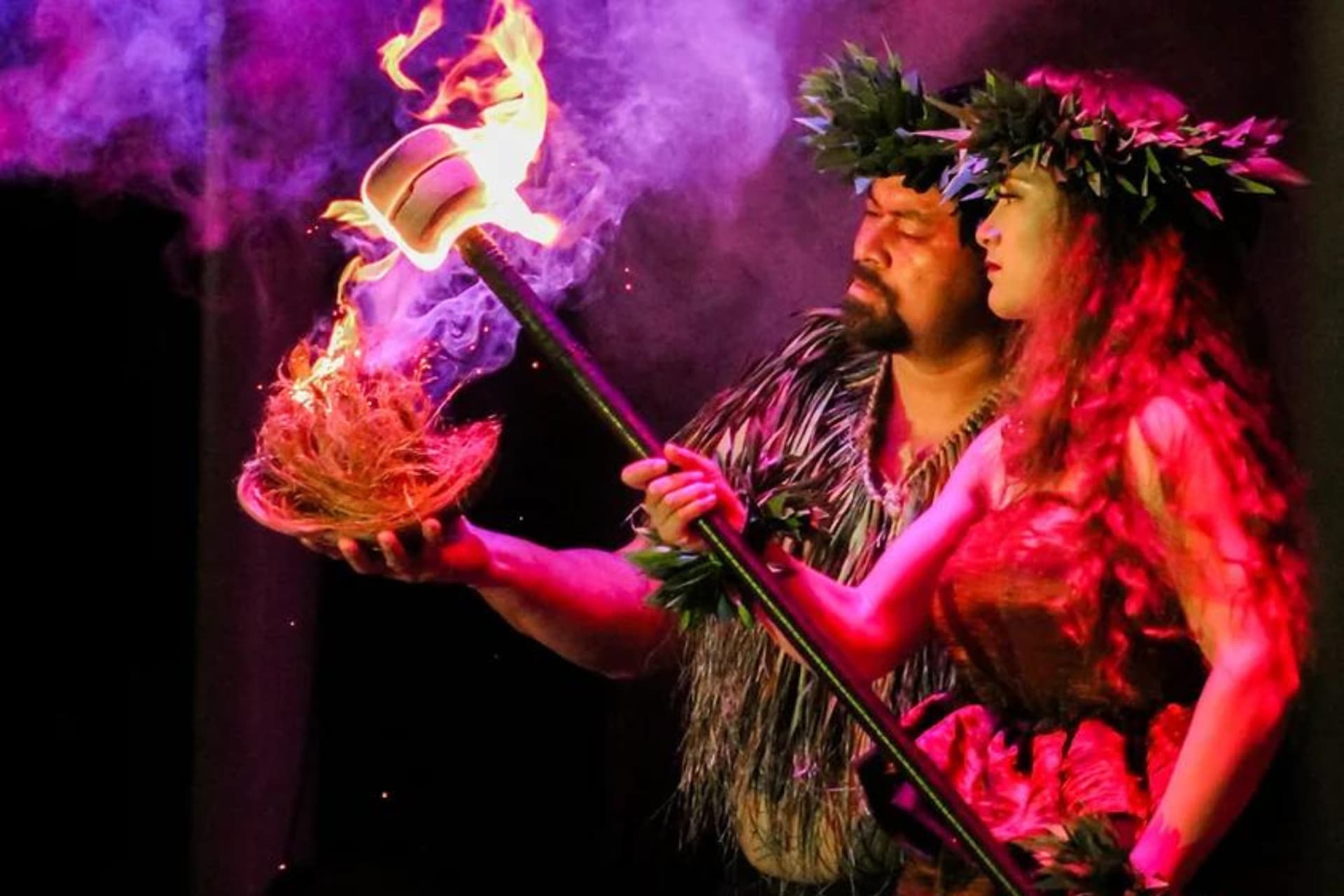 Performers light torches as the Ka Moana Luau evening show begins, Oahu.