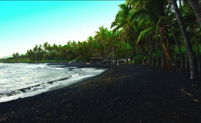 A black sand beach on the Southern shore of Hawaii's Big Island.