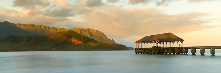 The Hanalei Pier at sunset. Just one of many movie sites, including Jurassic Park filming locations, Kauai has to offer.