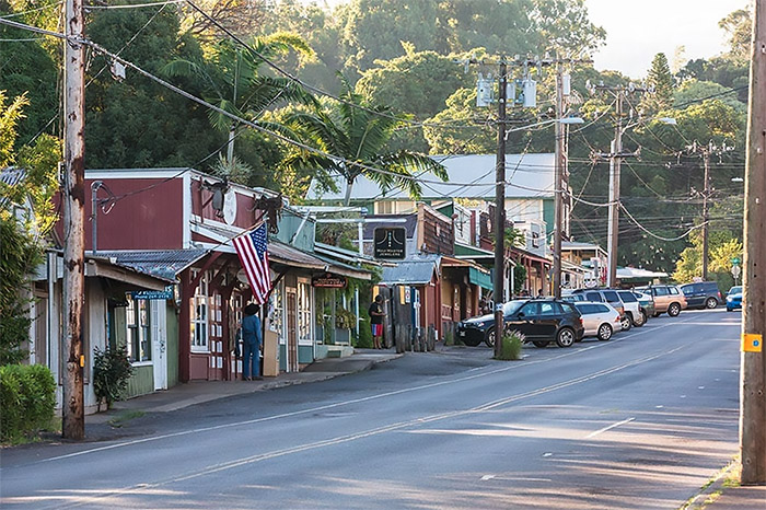 A classic downtown business street set in a tropical backdrop in the town on Makawao, Maui. 